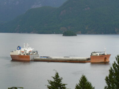 Highway Section - Remnants of seattle interstate I90 floating bridge were towed to vancouver for loading aboard a dockwise semi-submersible vessel for transport to southern california’s new part of port of los angeles.